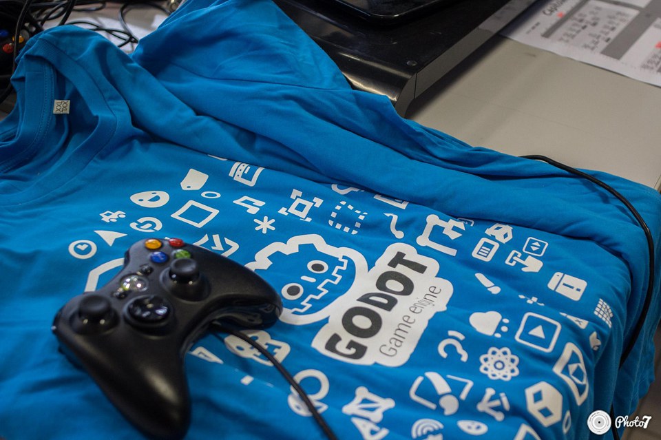 A stack of official Godot shirts at our stand