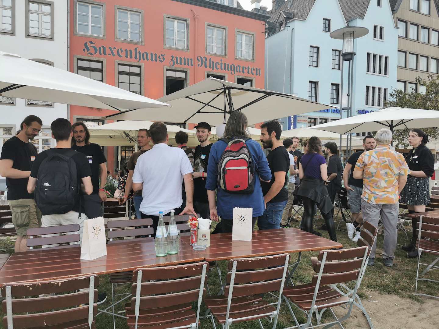 Attendees standing on a private patio in front of the Haxenhaus