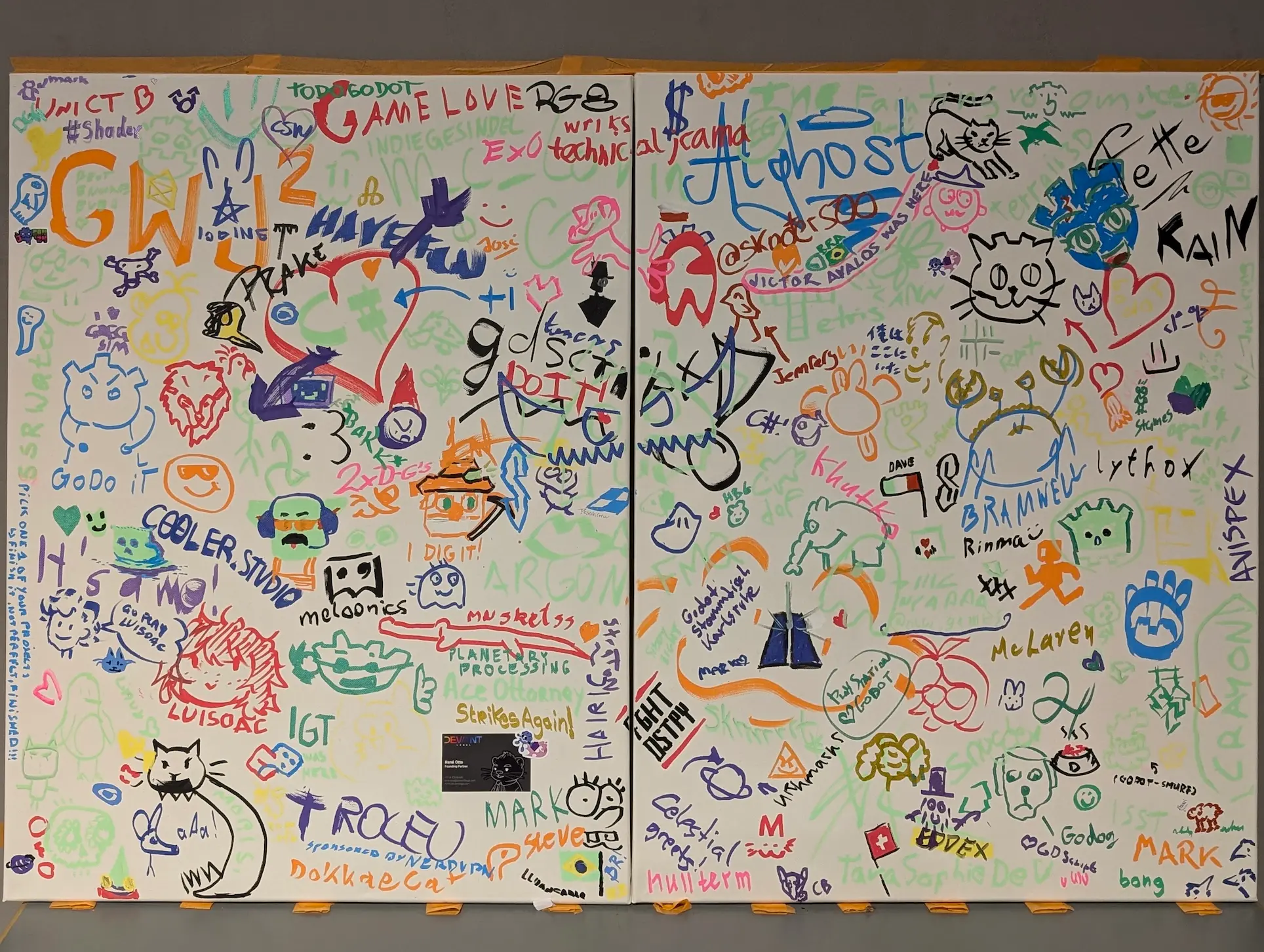 The graffiti canvas full of different drawings by the visitors